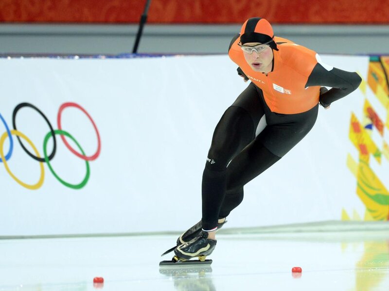 Speed Skater in Action — Orange, Intense, Photograph