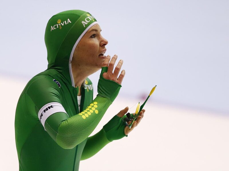 Speed Skater in Green Suit — Focused