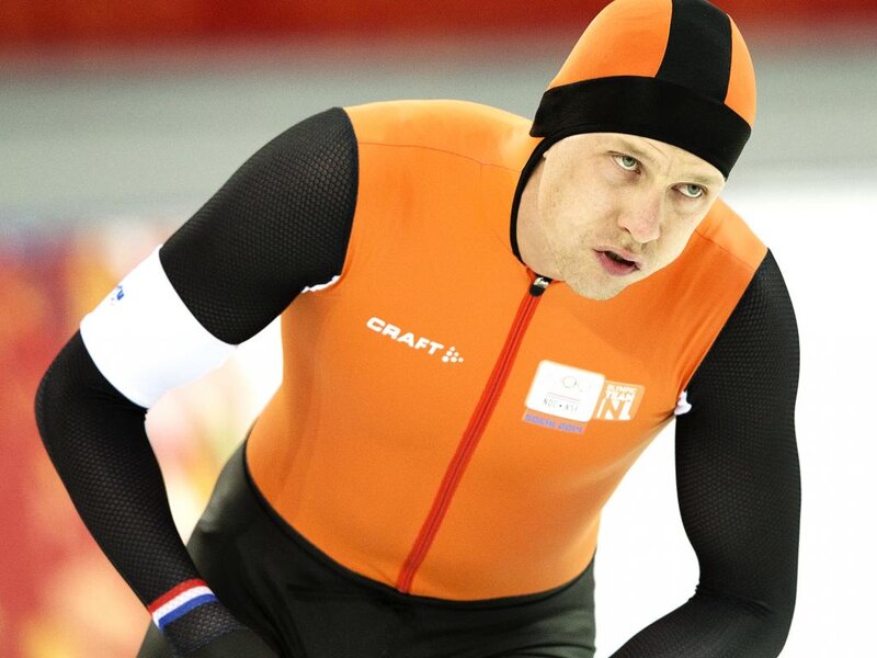 Speed Skater in Orange Suit — Focused, Photograph