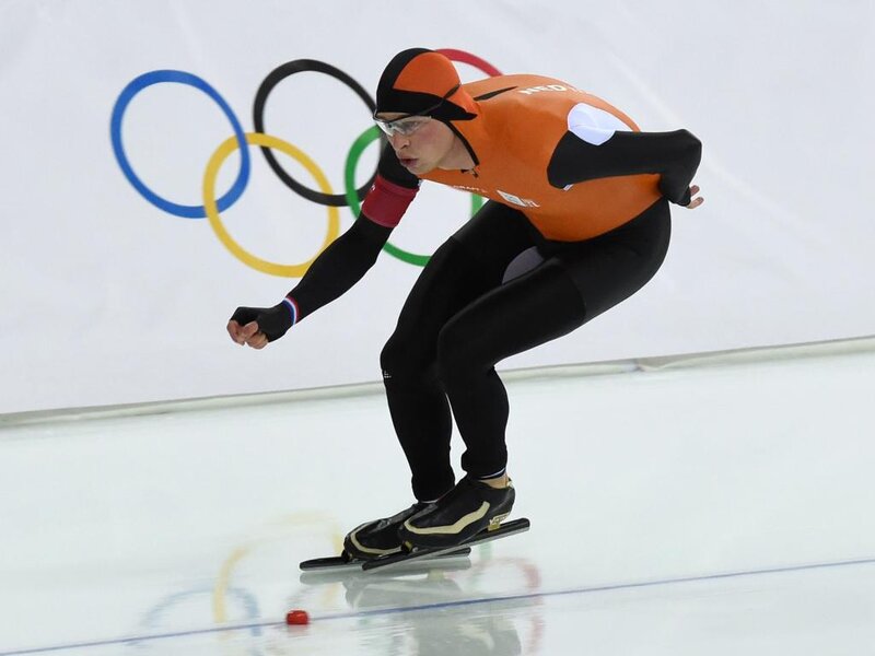 Speed Skater in Orange Suit — Focused