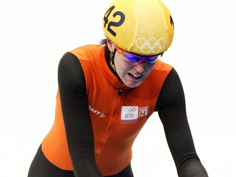 Speed Skater in Orange Suit — Intense, Photograph, Helmet