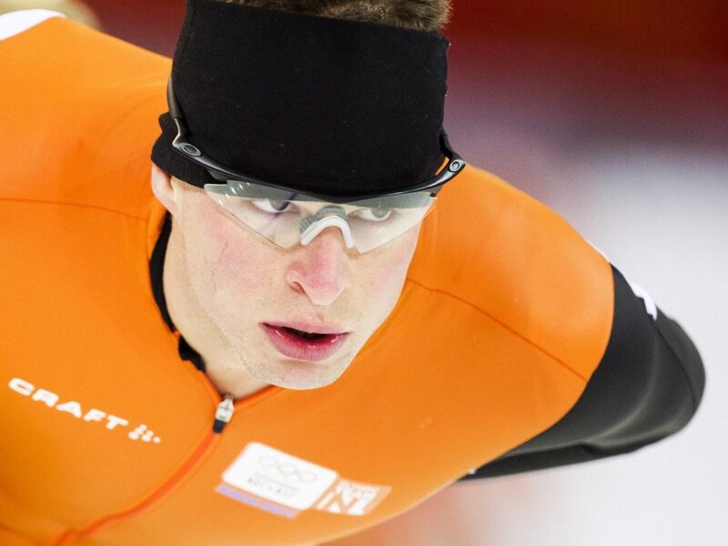 Speed Skater in Orange Suit — Intense, Photograph