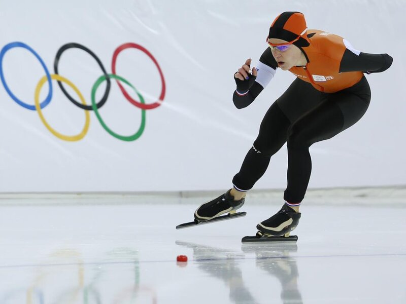Speed Skater on Ice — Orange, Focused, Photograph