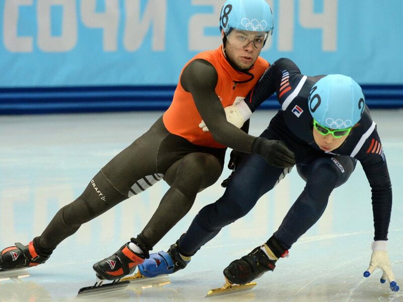 Speed Skaters in Competition — Blue