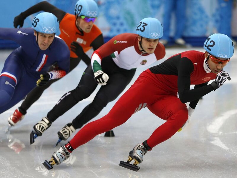 Speed Skaters in Competition — Red