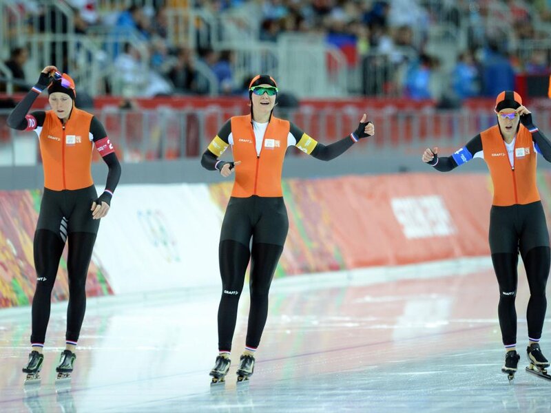 Speed Skaters on Ice — Orange, Competitive, Photograph