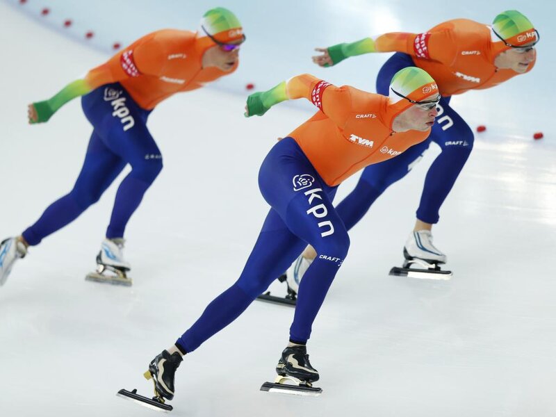 Speed Skaters on Ice — Orange