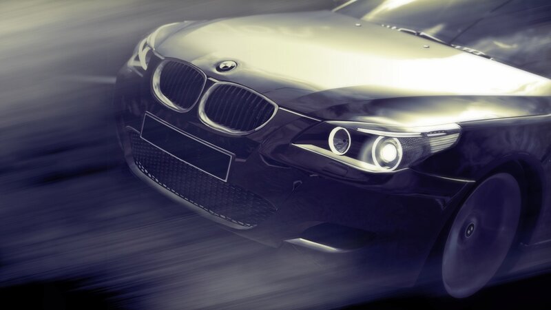 speeding black BMW car