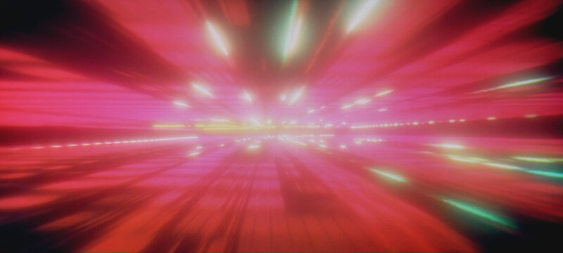 speeding through a neon tunnel