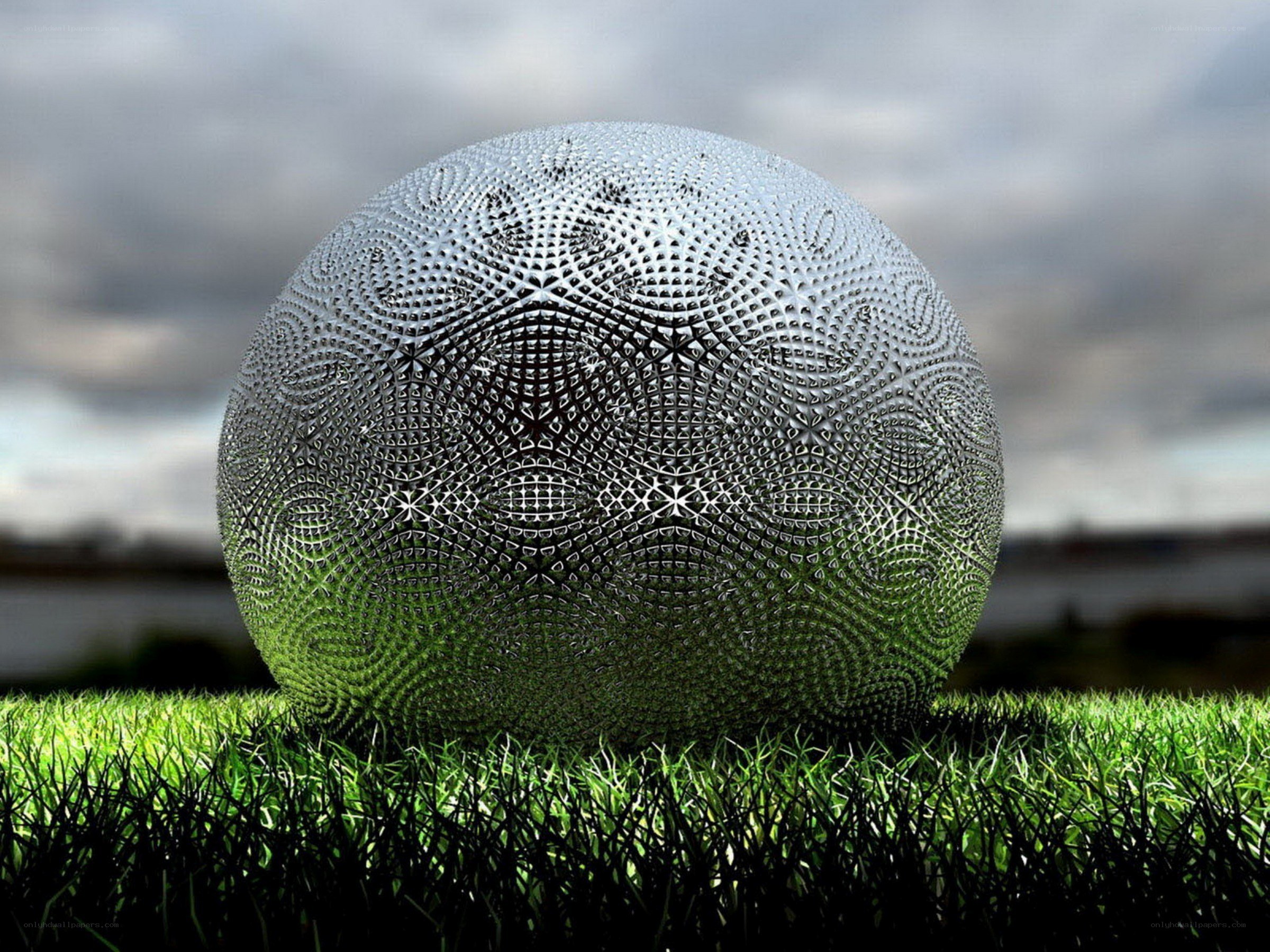 Spherical sculpture on grass