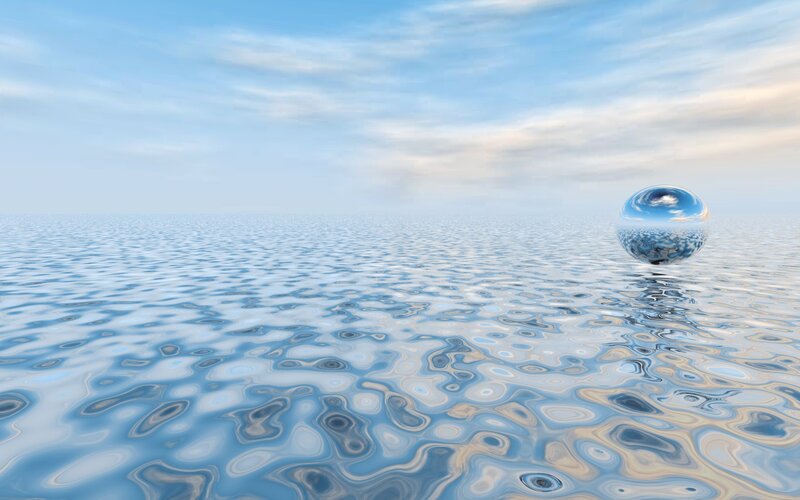 Spherical water droplet on calm sea
