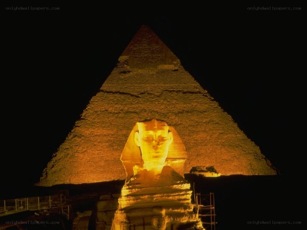 Sphinx and pyramid at night