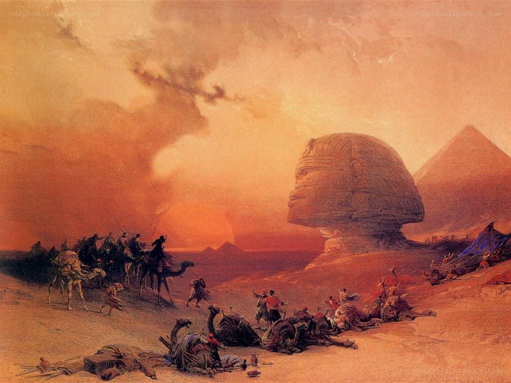 Sphinx at sunset with travelers