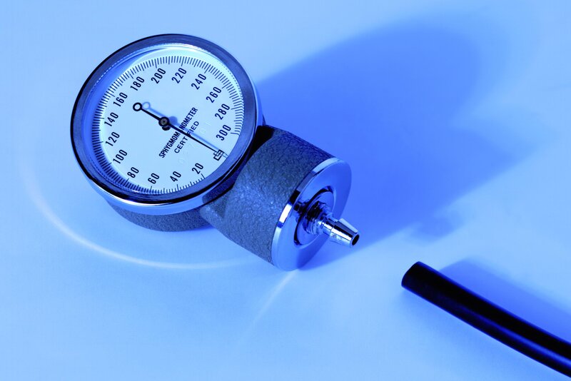 sphygmomanometer on blue surface