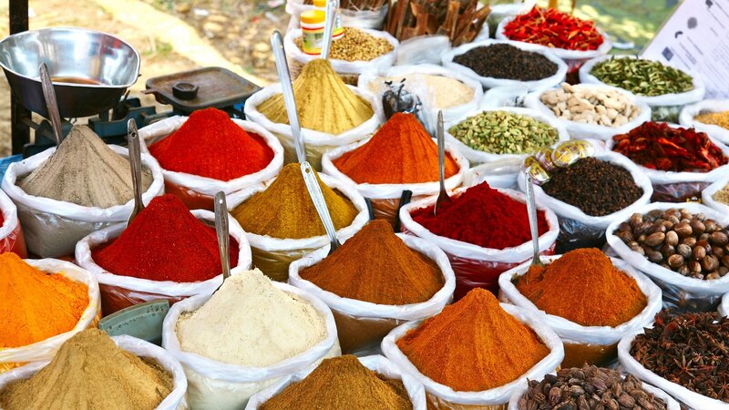 Spice market stall with colorful powders