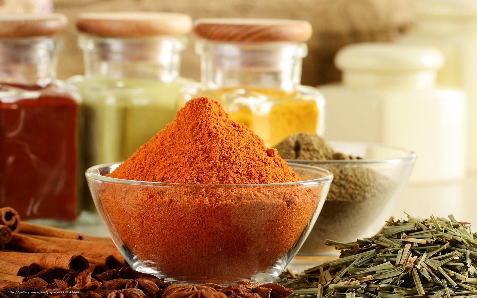Spices and herbs in glass bowls