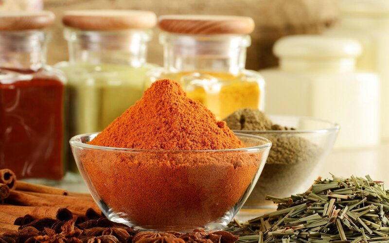 Spices and herbs in glass bowls