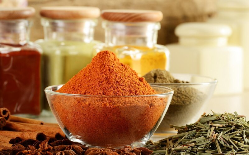 Spices and herbs in glass bowls