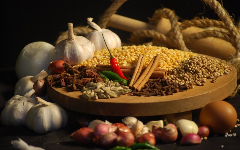 Spices and herbs on a wooden board