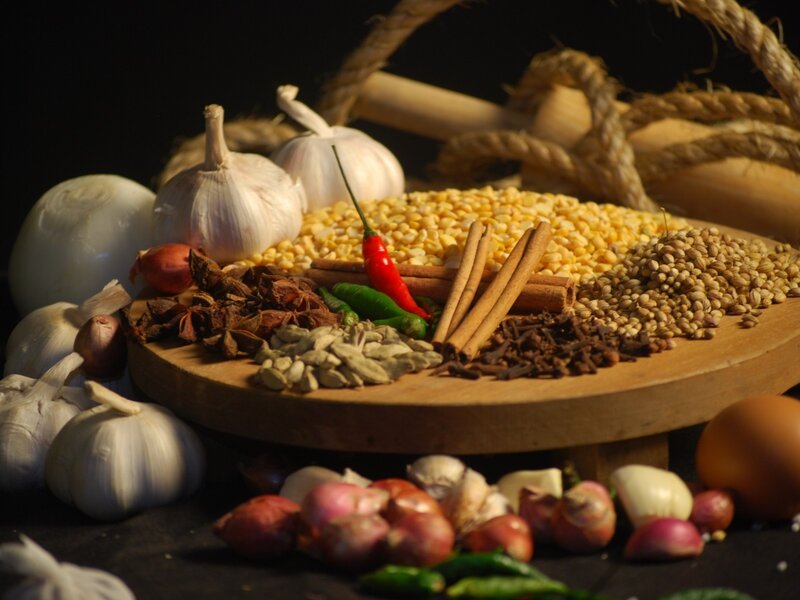 Spices and herbs on a wooden board