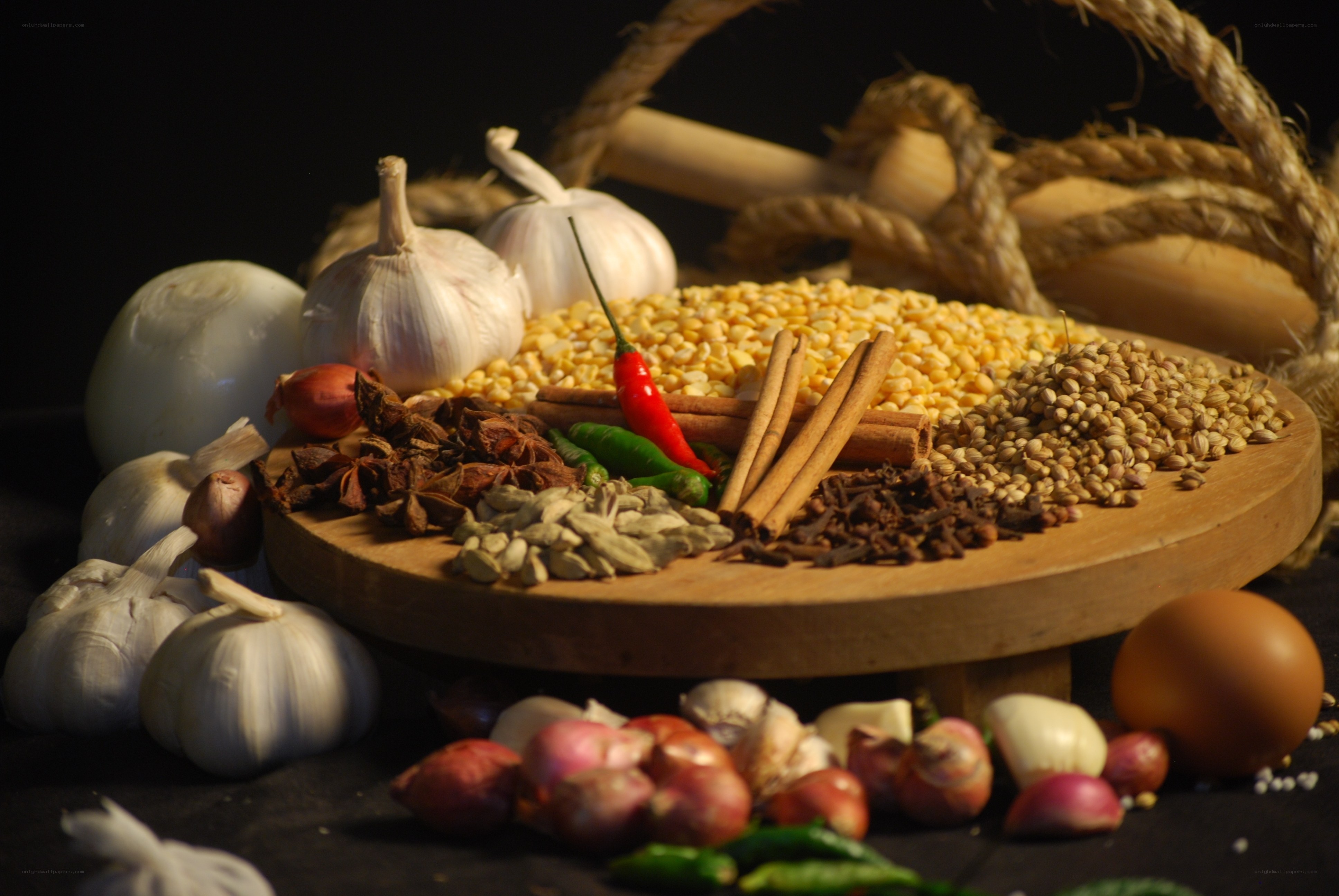 Spices and herbs on a wooden board