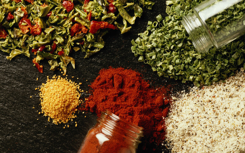 spices and herbs on black slate