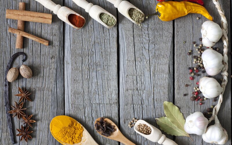 spices and herbs on wood