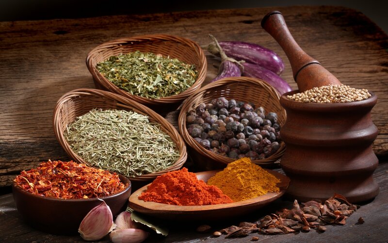 Spices and herbs on wood