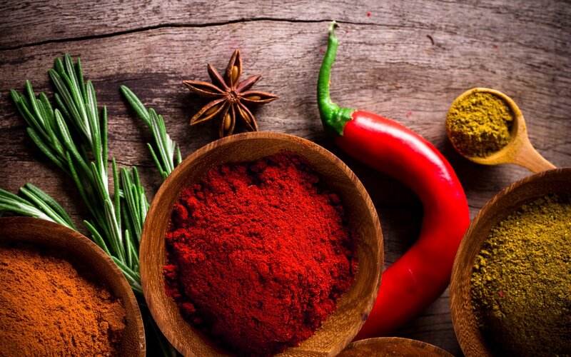 spices and herbs on wood