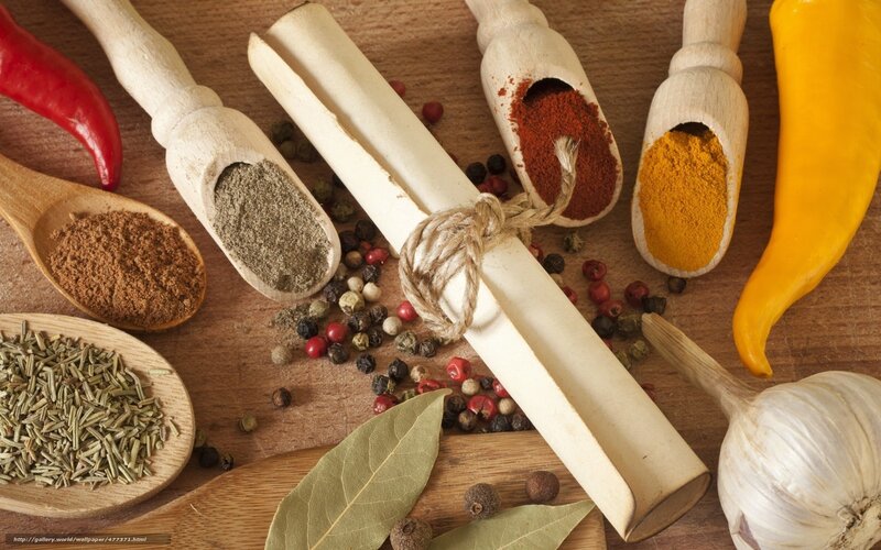 Spices and herbs on wooden surface