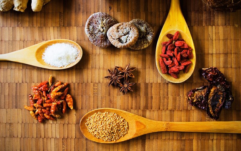 spices and herbs on wooden surface