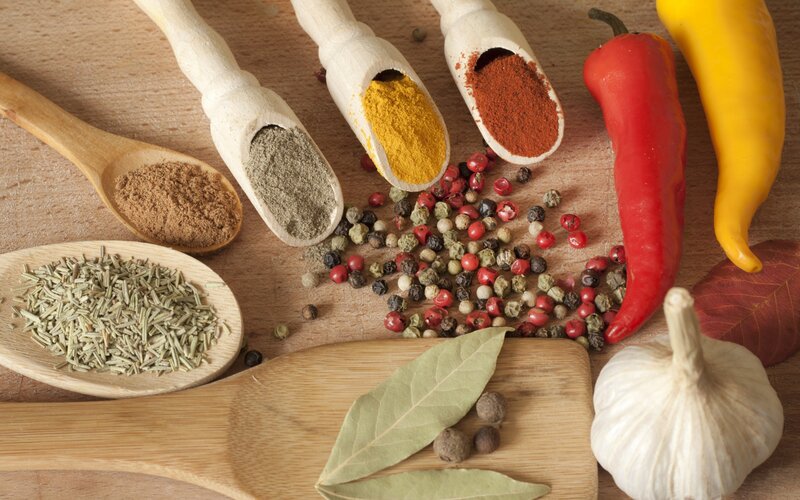 Spices and herbs on wooden surface
