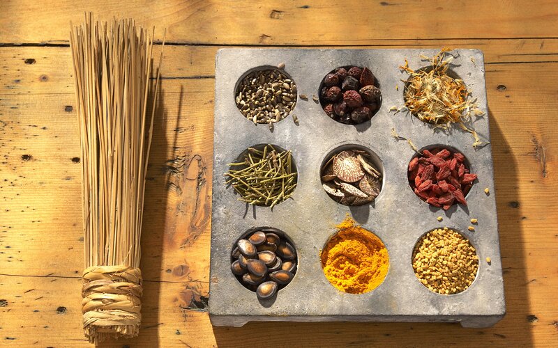 Spices and herbs on wooden table