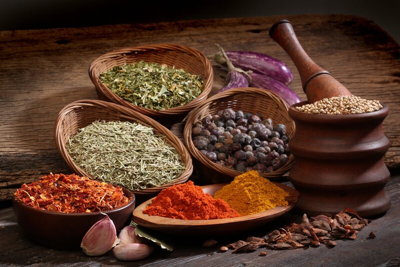 Spices and herbs on wooden table