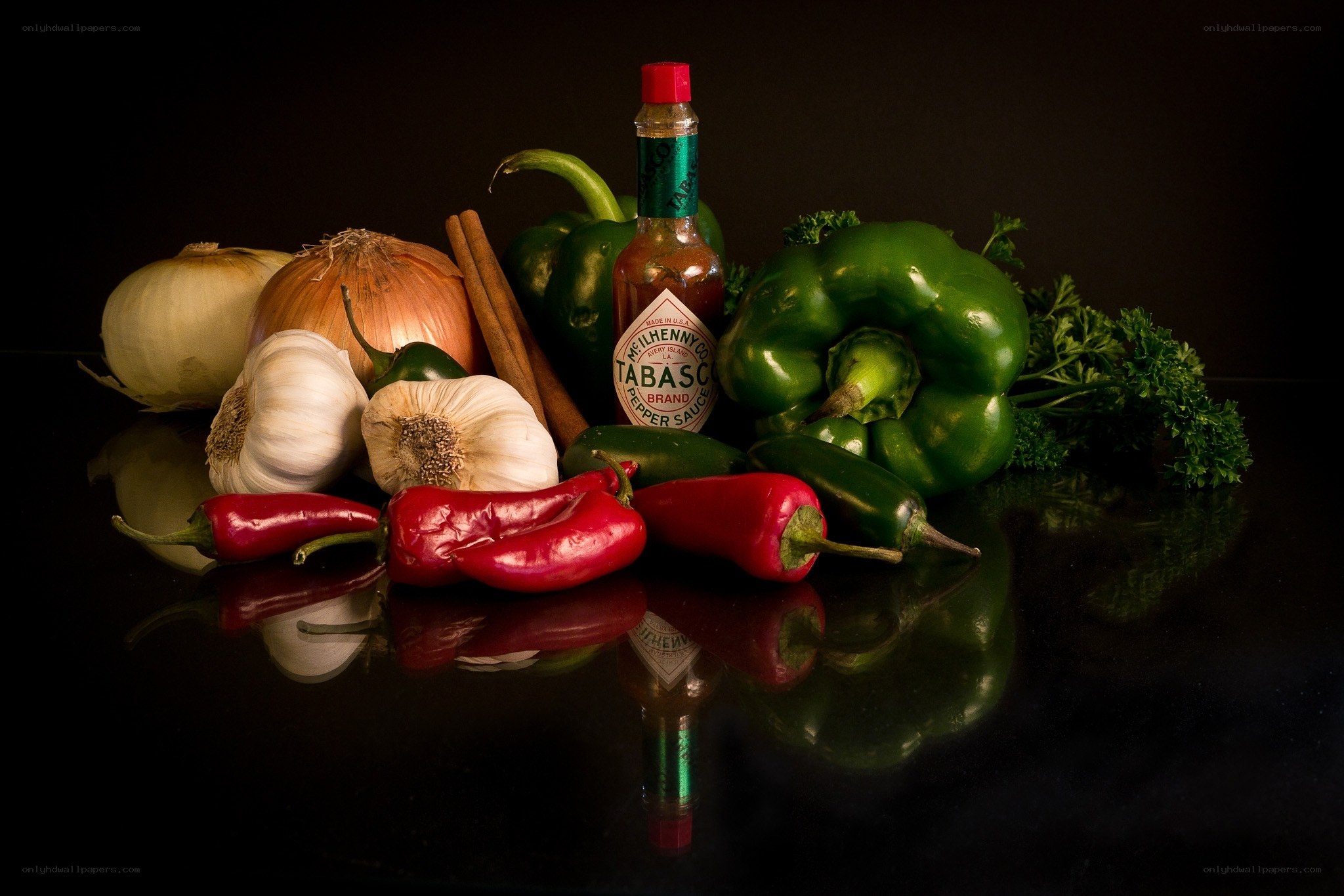 Spices and peppers on black