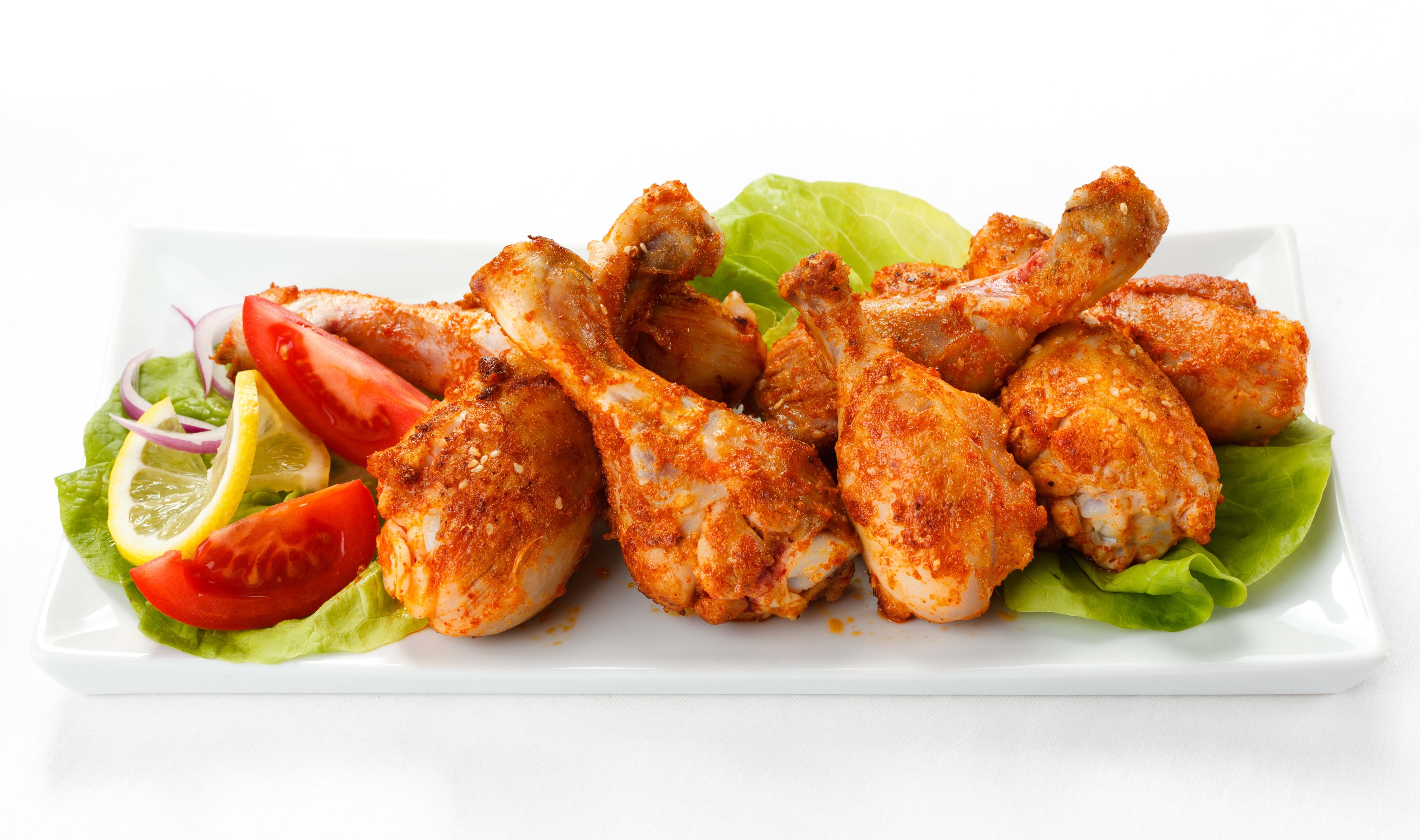 Spicy chicken drumsticks with salad