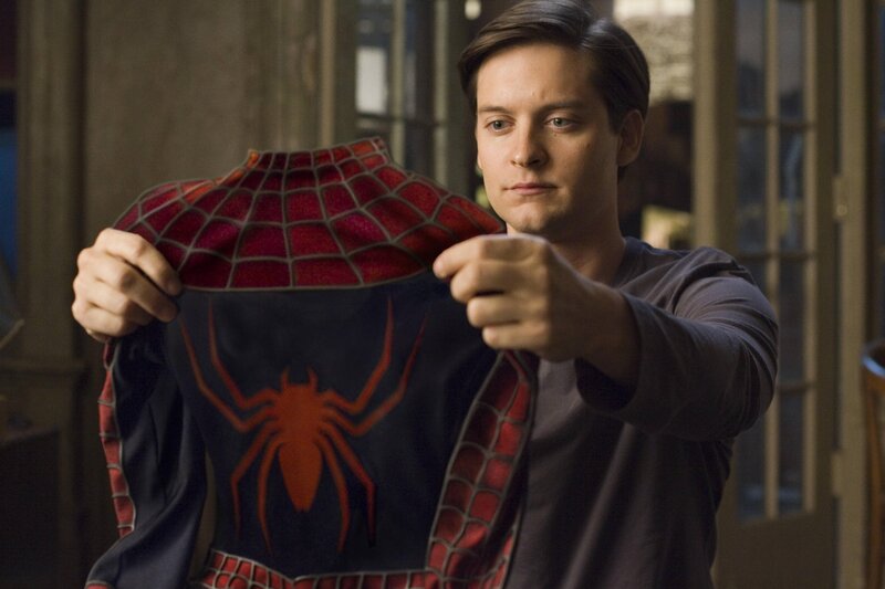 Spider-Man costume held by Peter Parker
