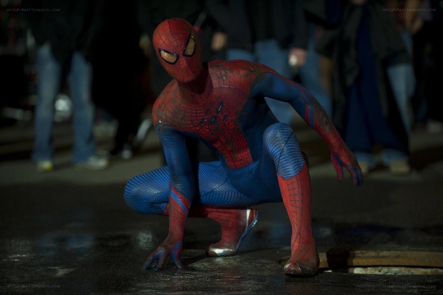Spider-Man crouching on street