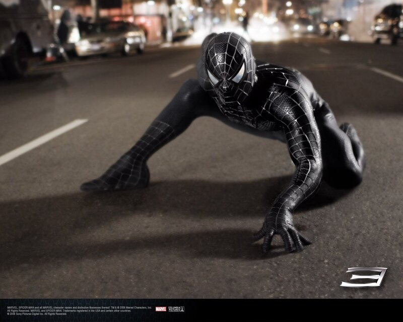 Spider-Man in black suit on street