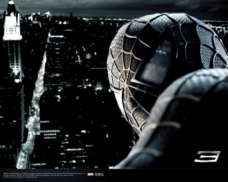 Spider-Man in black suit overlooking city