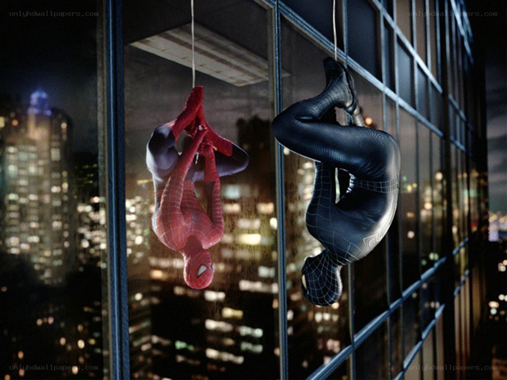 Spider-Man in red and black suits