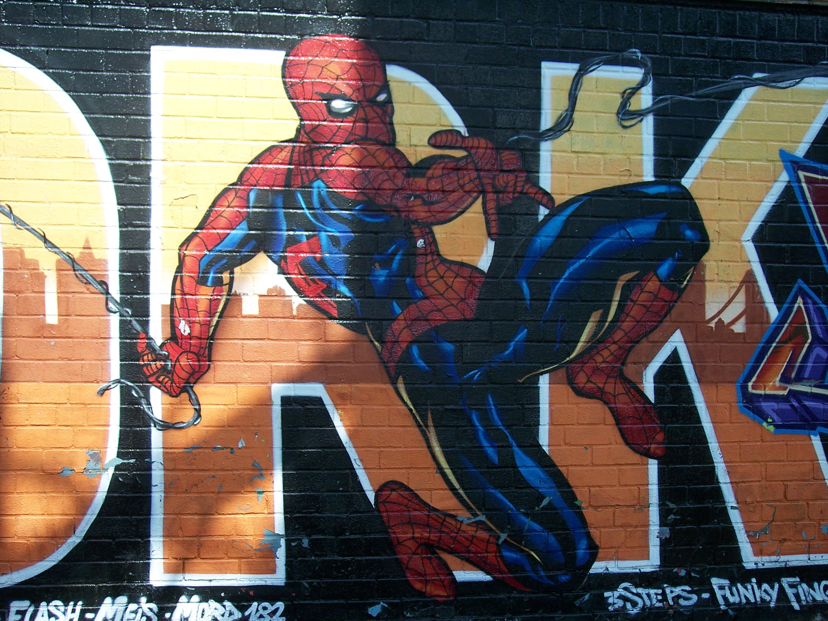 Spider-Man mural on brick wall