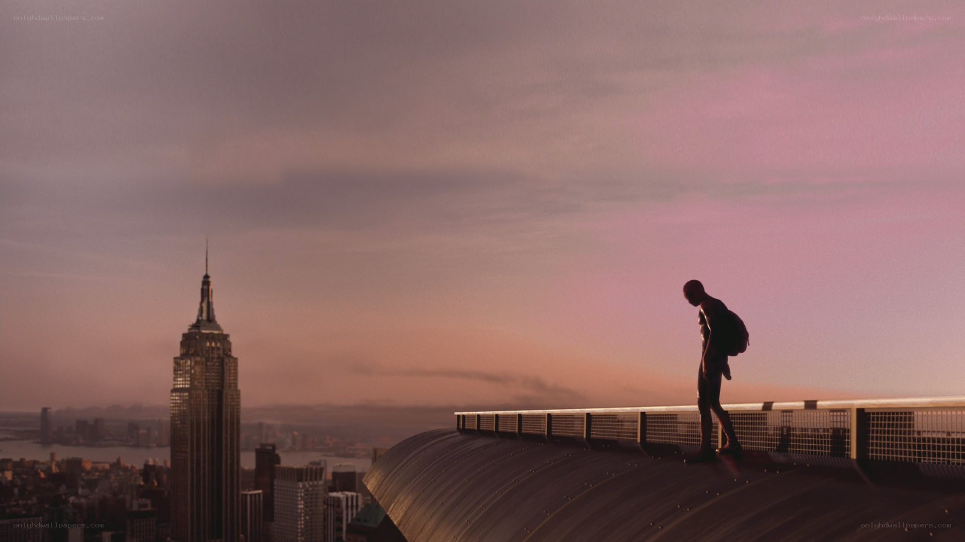 Spider-Man on a rooftop at sunset