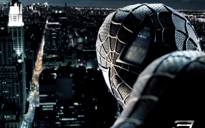 Spider-Man overlooking city at night