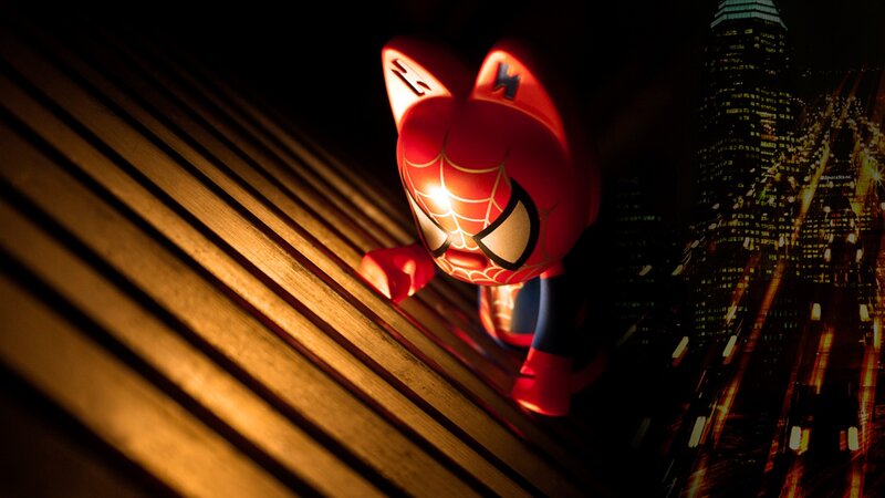 Spider-Man toy on city rooftop