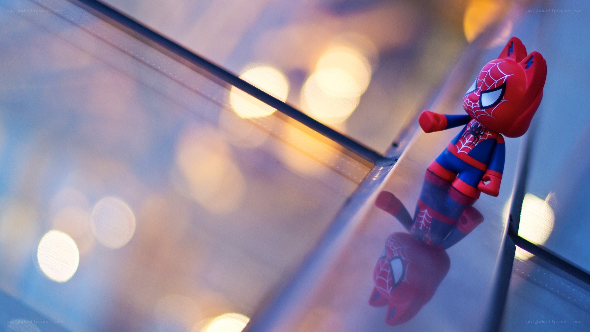 Spider-Man toy on glass surface