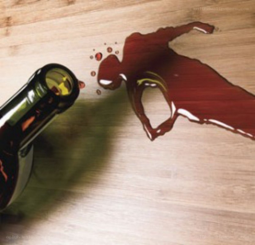 Spilled wine on wooden surface