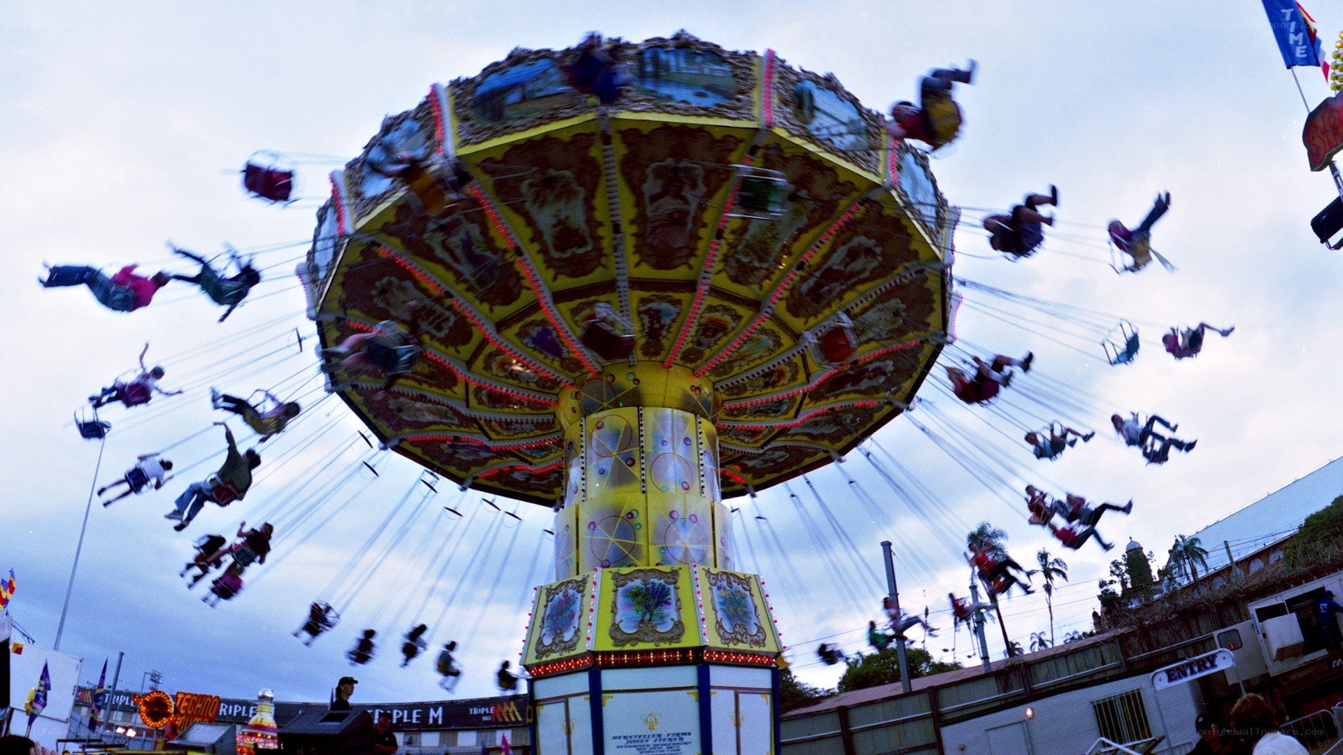 Spinning carnival ride at dusk