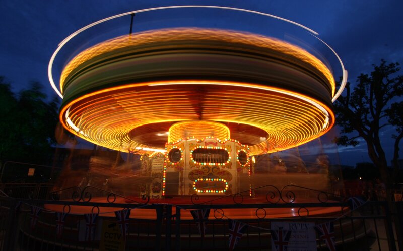 Spinning carousel at dusk