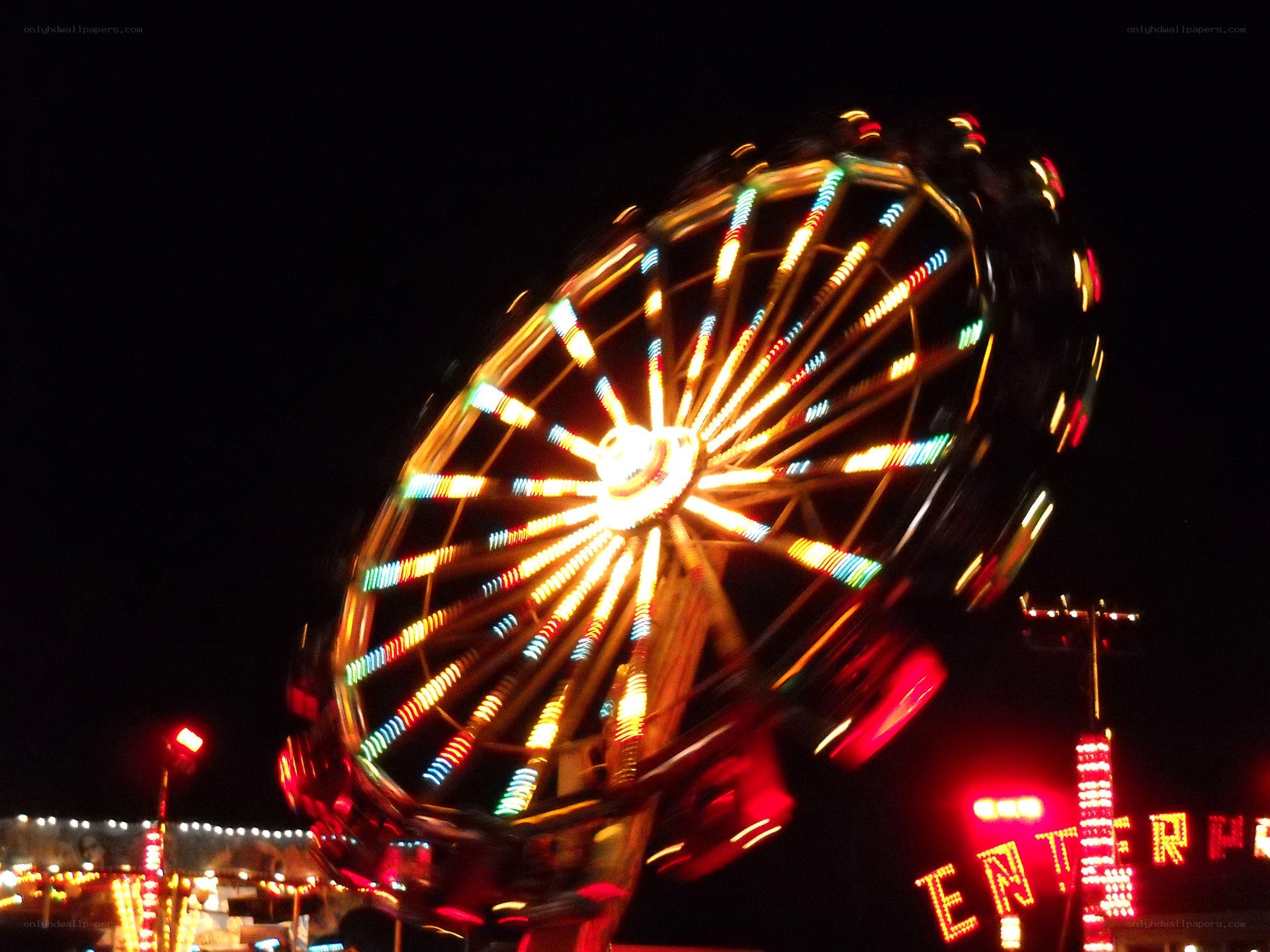 Spinning Ferris Wheel at Night